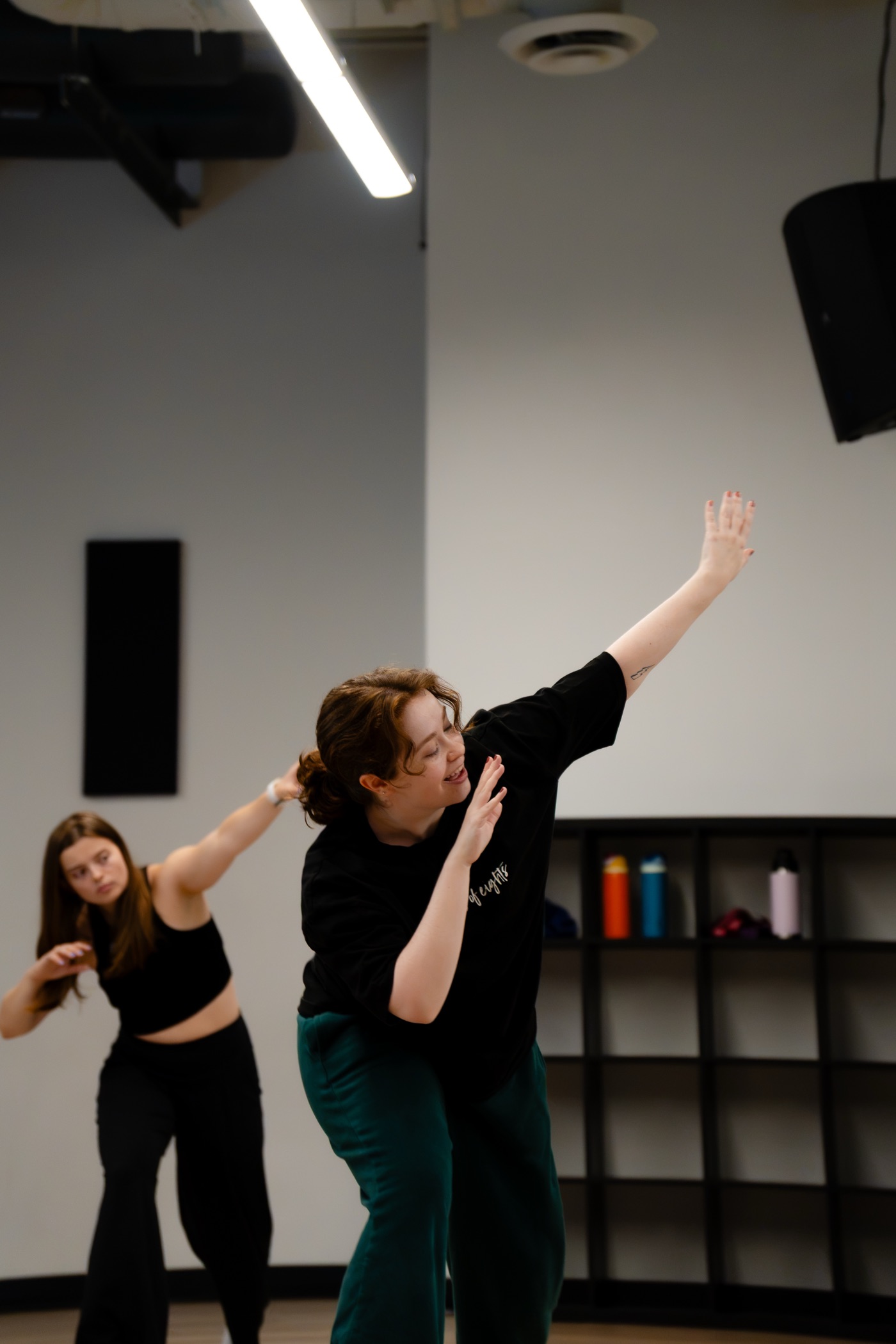A dancer smiling mid-move in class at House of Eights
